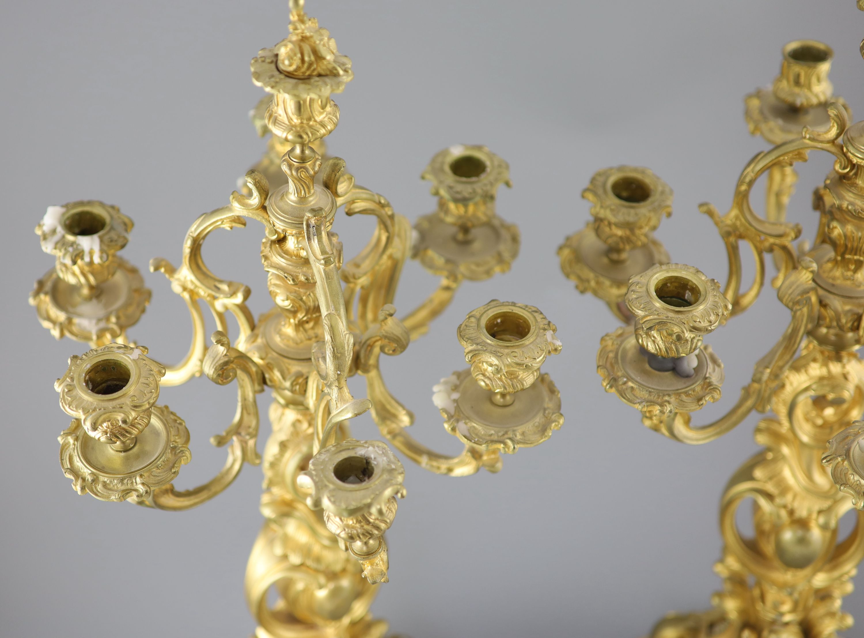 A pair of late 19th century French Louis XV style ormolu seven light candelabra, height 26in.